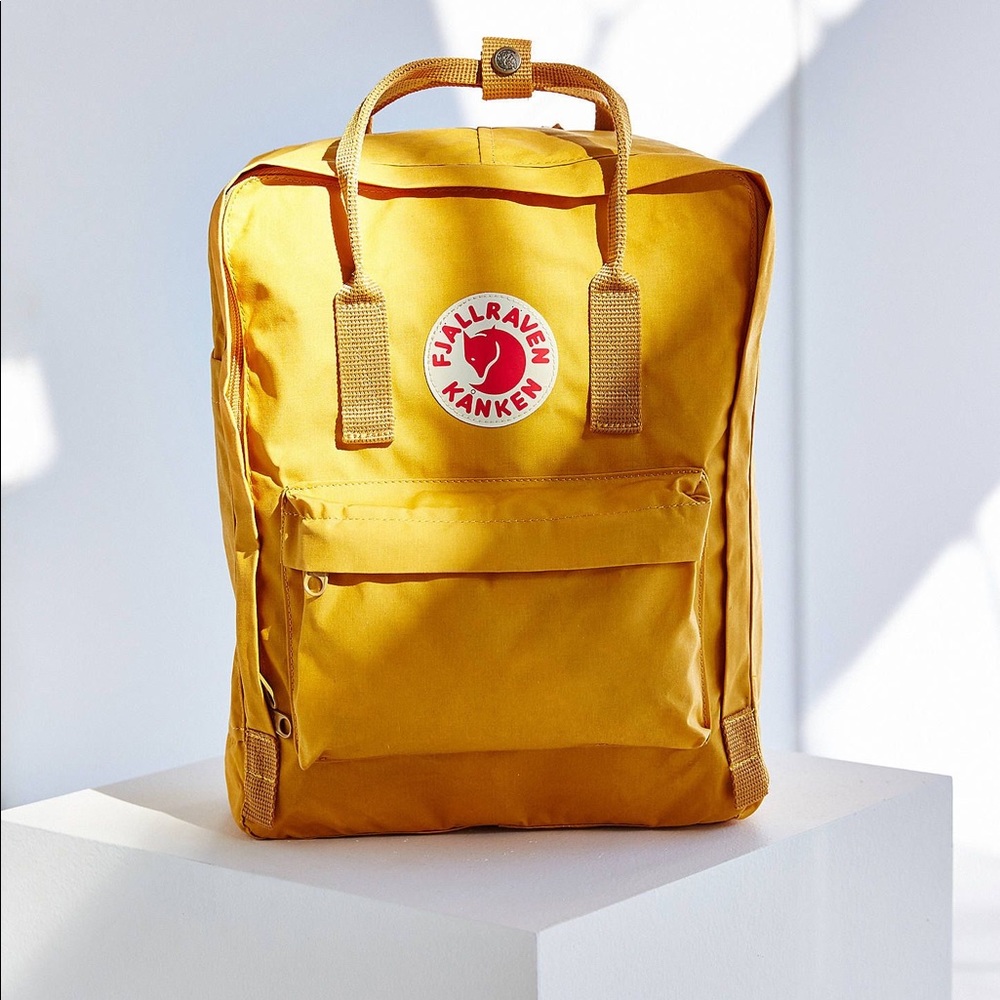 Yellow full sized Kanken backpack
